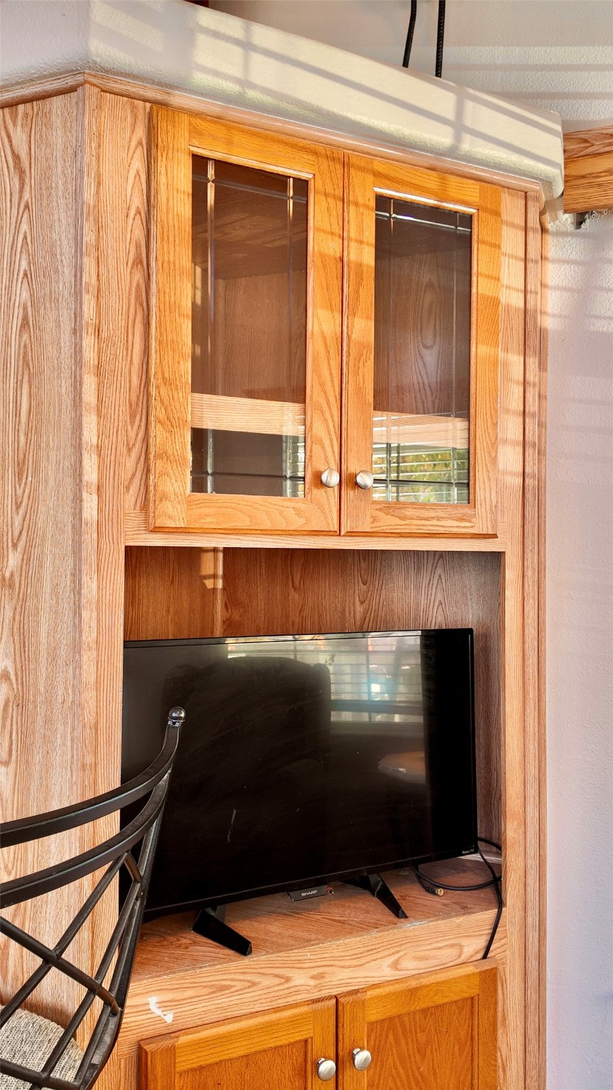 11720 Thousand Trail, Unit 13 Conroe, TX 77304 - Photo 14 of 35 a living room with a chair and a fireplace