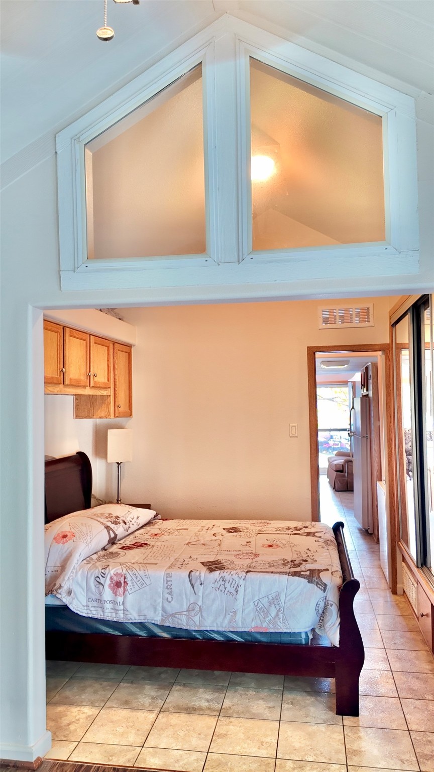 11720 Thousand Trail, Unit 13 Conroe, TX 77304 - Photo 22 of 35 a bedroom with a bed and window