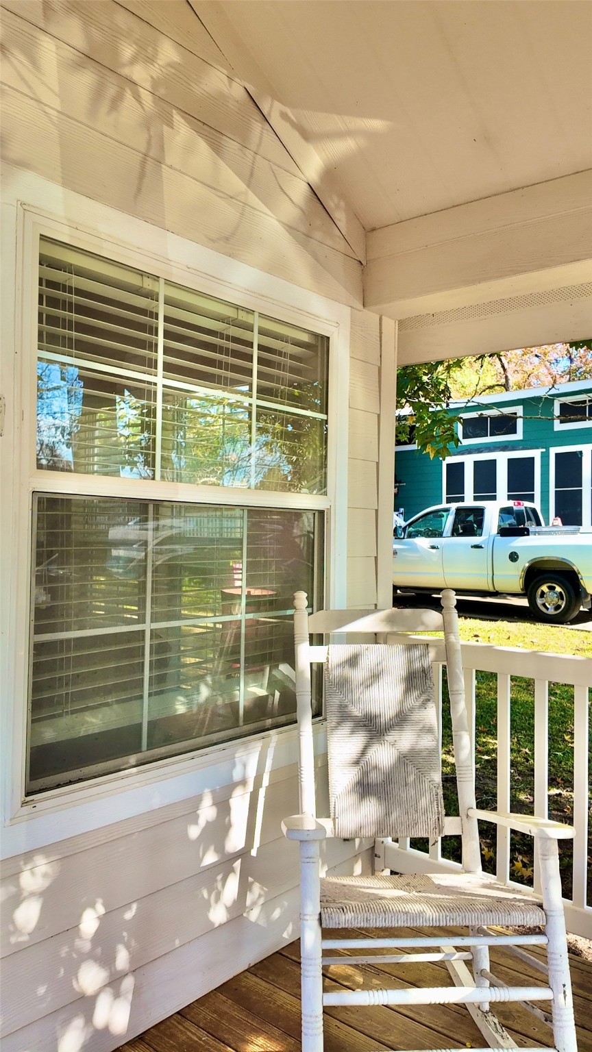 11720 Thousand Trail, Unit 13 Conroe, TX 77304 - Photo 4 of 35 a view of a porch with a floor to ceiling window
