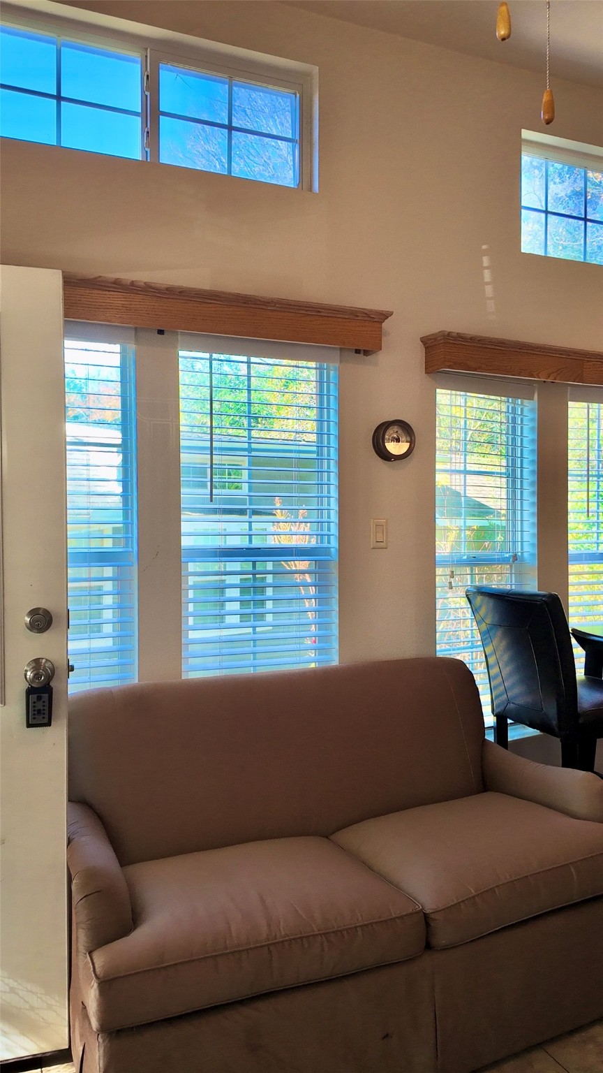 11720 Thousand Trail, Unit 13 Conroe, TX 77304 - Photo 6 of 35 a living room with a couch and a window