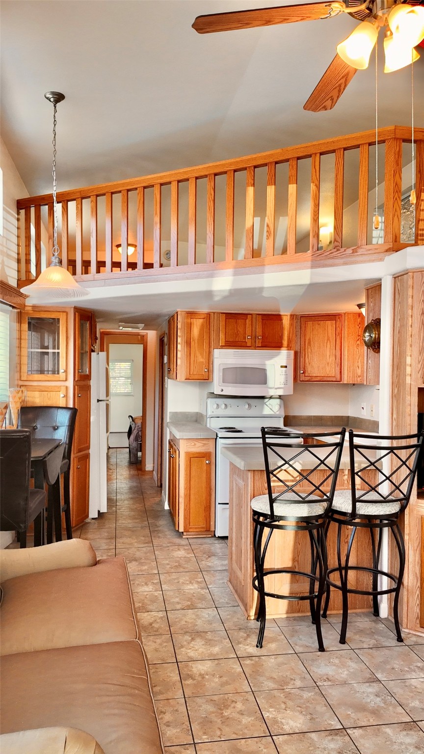 11720 Thousand Trail, Unit 13 Conroe, TX 77304 - Photo 9 of 35 a dining room with a table and chairs