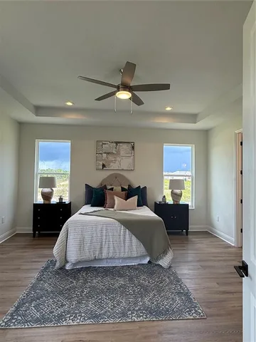 a bedroom with a bed and a couch