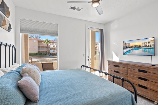 1122 South 1790th Street West, Unit 2 St. George, UT 84770 - Photo 23 of 37 Bedroom featuring a window with cellular blinds and a glass-paneled door leading to an outdoor space