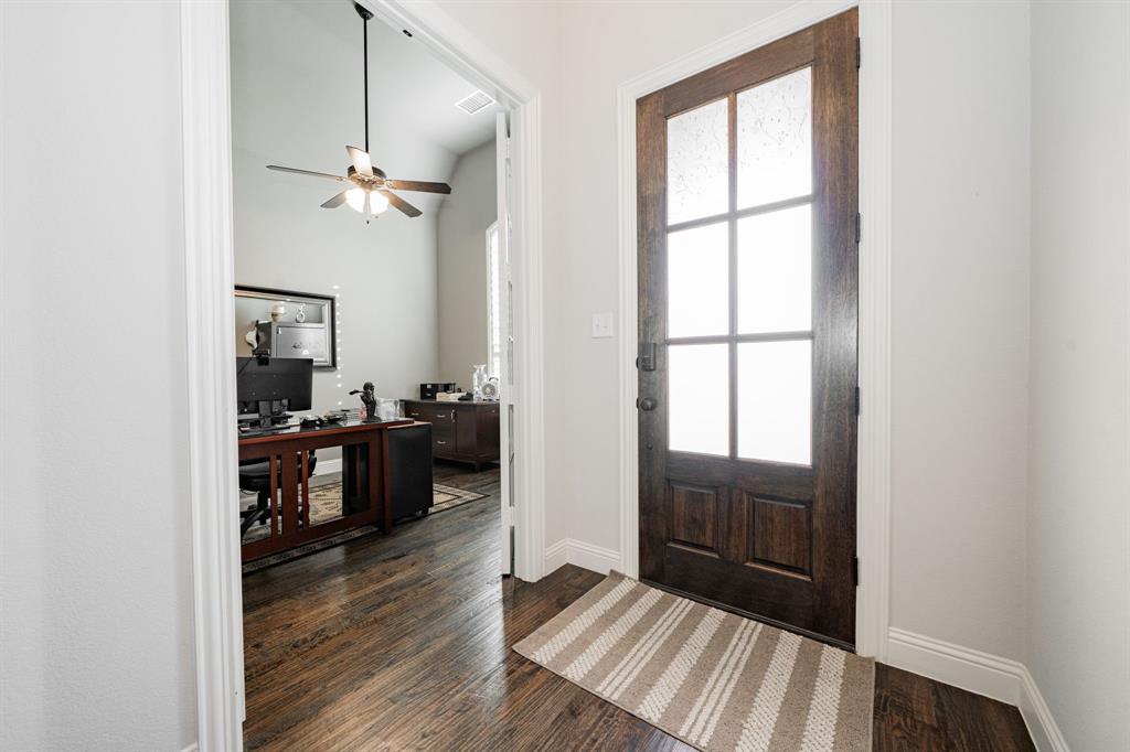 944 Highpoint Way Roanoke, TX 76262 - Photo 2 of 39 a view of a hallway view with wooden floor and a bathroom