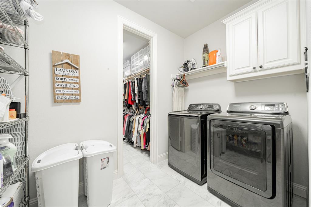 944 Highpoint Way Roanoke, TX 76262 - Photo 23 of 39 a utility room with fridge dryer and washer