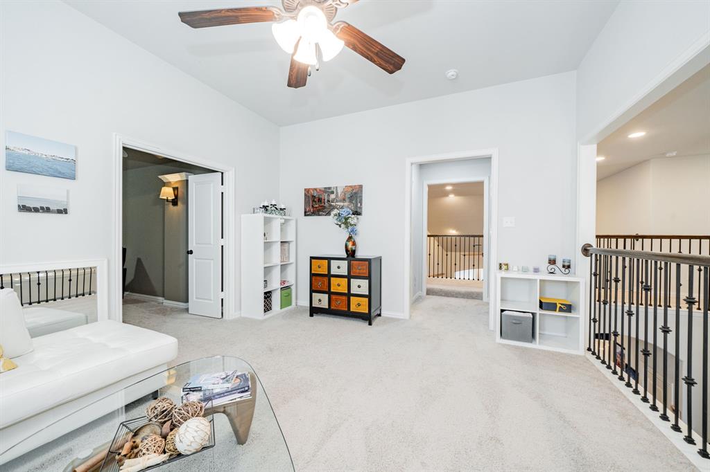 944 Highpoint Way Roanoke, TX 76262 - Photo 25 of 39 a living room with furniture and a flat tv screen