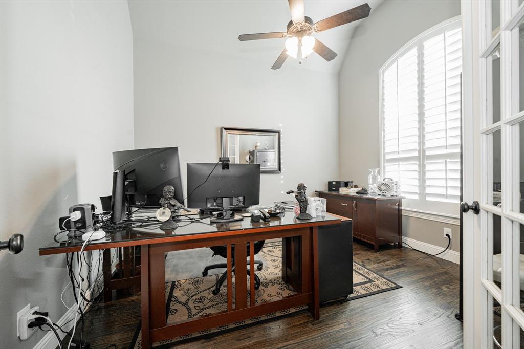 944 Highpoint Way Roanoke, TX 76262 - Photo 3 of 39 a room with a chandelier furniture a flat screen tv and a window