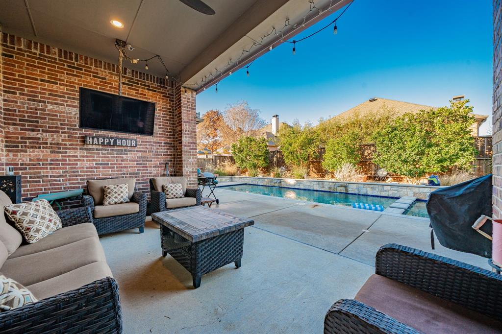 944 Highpoint Way Roanoke, TX 76262 - Photo 38 of 39 a outdoor living space with furniture and a flat screen tv