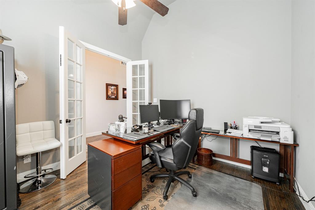 944 Highpoint Way Roanoke, TX 76262 - Photo 4 of 39 a view of a workspace with furniture and a window