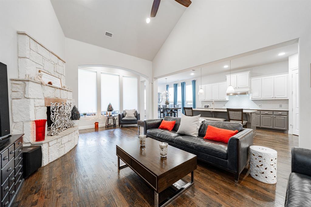 944 Highpoint Way Roanoke, TX 76262 - Photo 6 of 39 a living room with furniture and a wooden floor