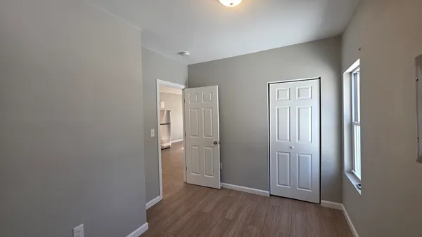 a view of wooden floor in an empty room