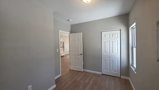 a view of wooden floor in an empty room