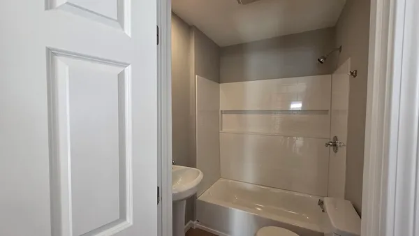 a bathroom with a shower and toilet