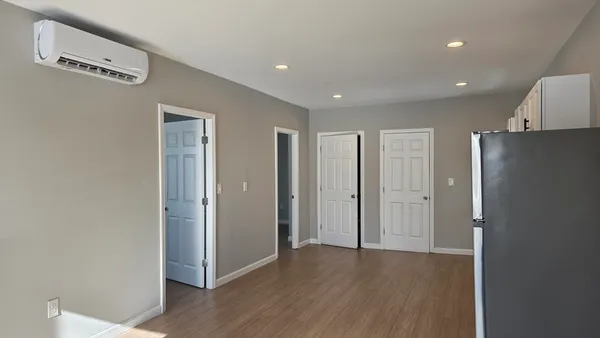 a view of a livingroom with wooden floor