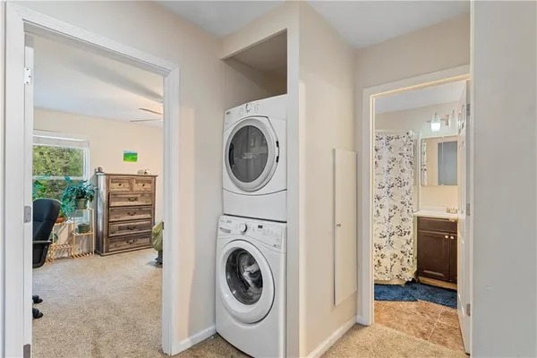 a view of a hallway with washer and dryer