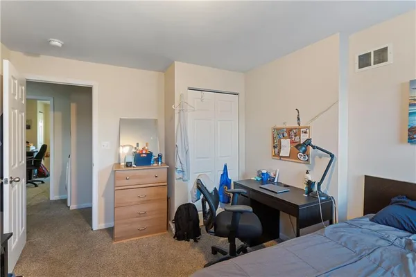 a room with a couch and a desk