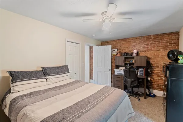 a bedroom with a bed and a walk in closet