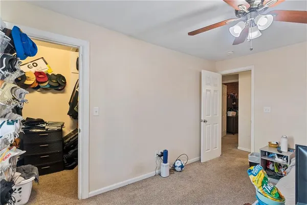 a bathroom with a sink vanity mirror and toilet