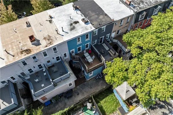an aerial view of a house with a garden