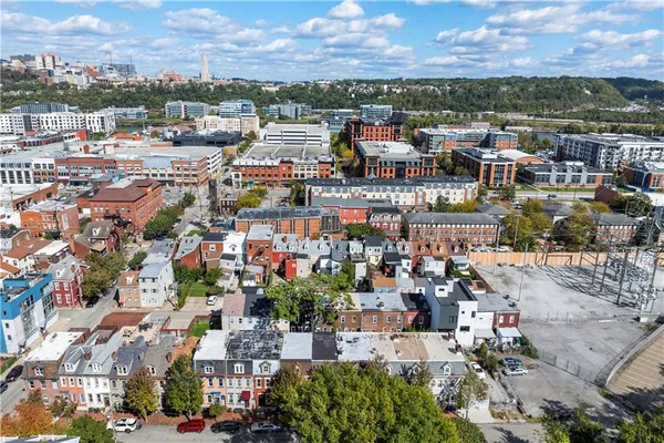 a view of a patio with couches and a fire pit