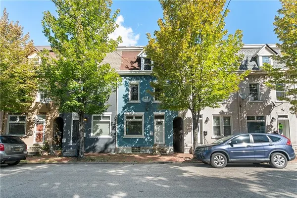 a car parked in front of a house