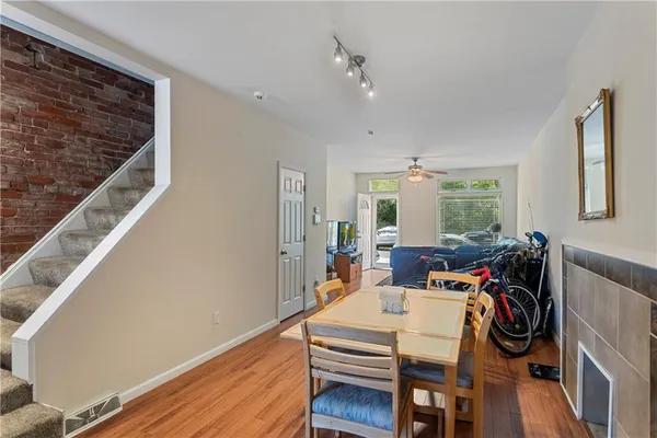 a view of a dining room with furniture window and wooden floor