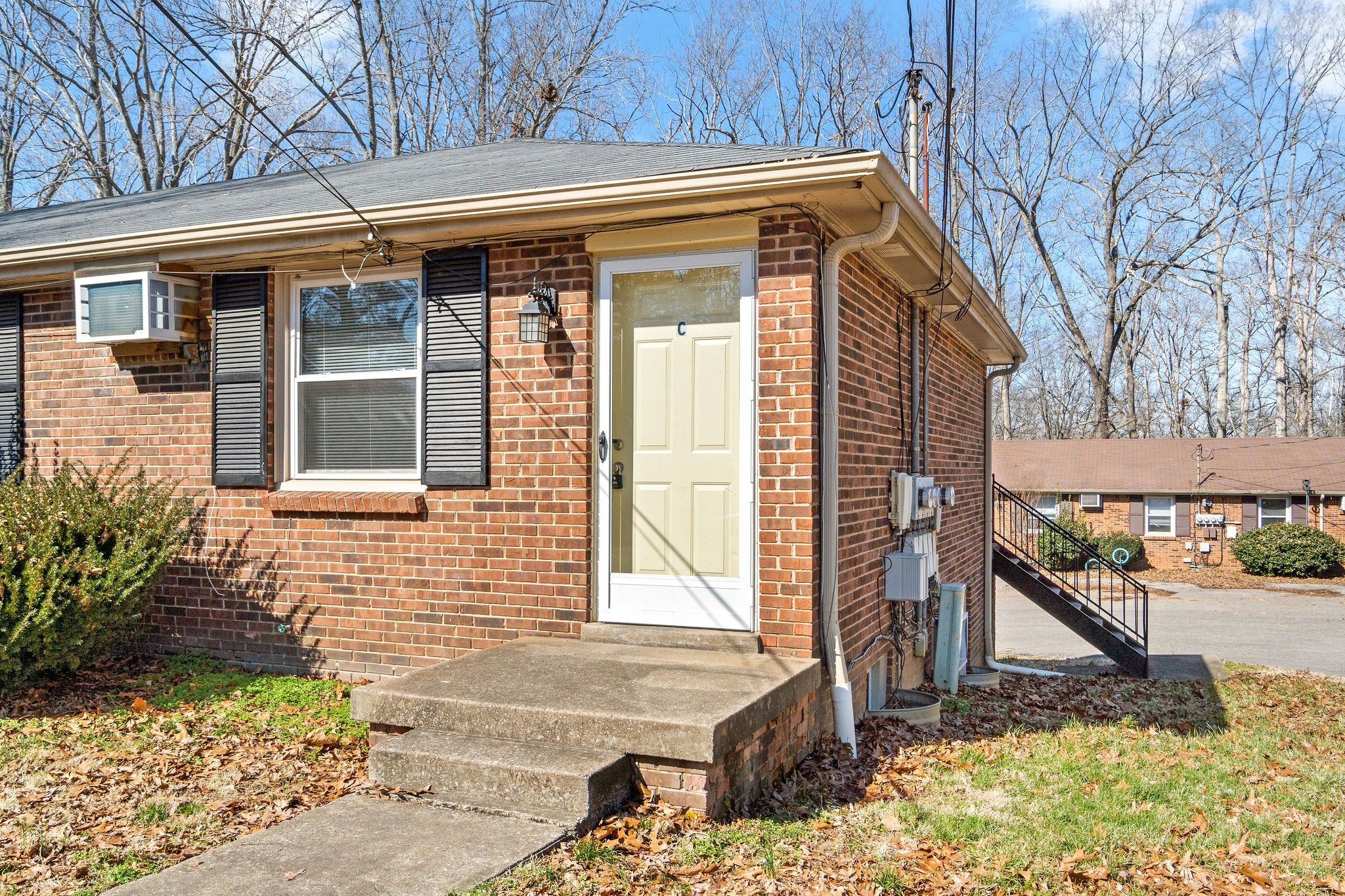 1908 Batts Lane, Unit C Clarksville, TN 37042 - Photo 1 of 14 a front view of a house with a yard