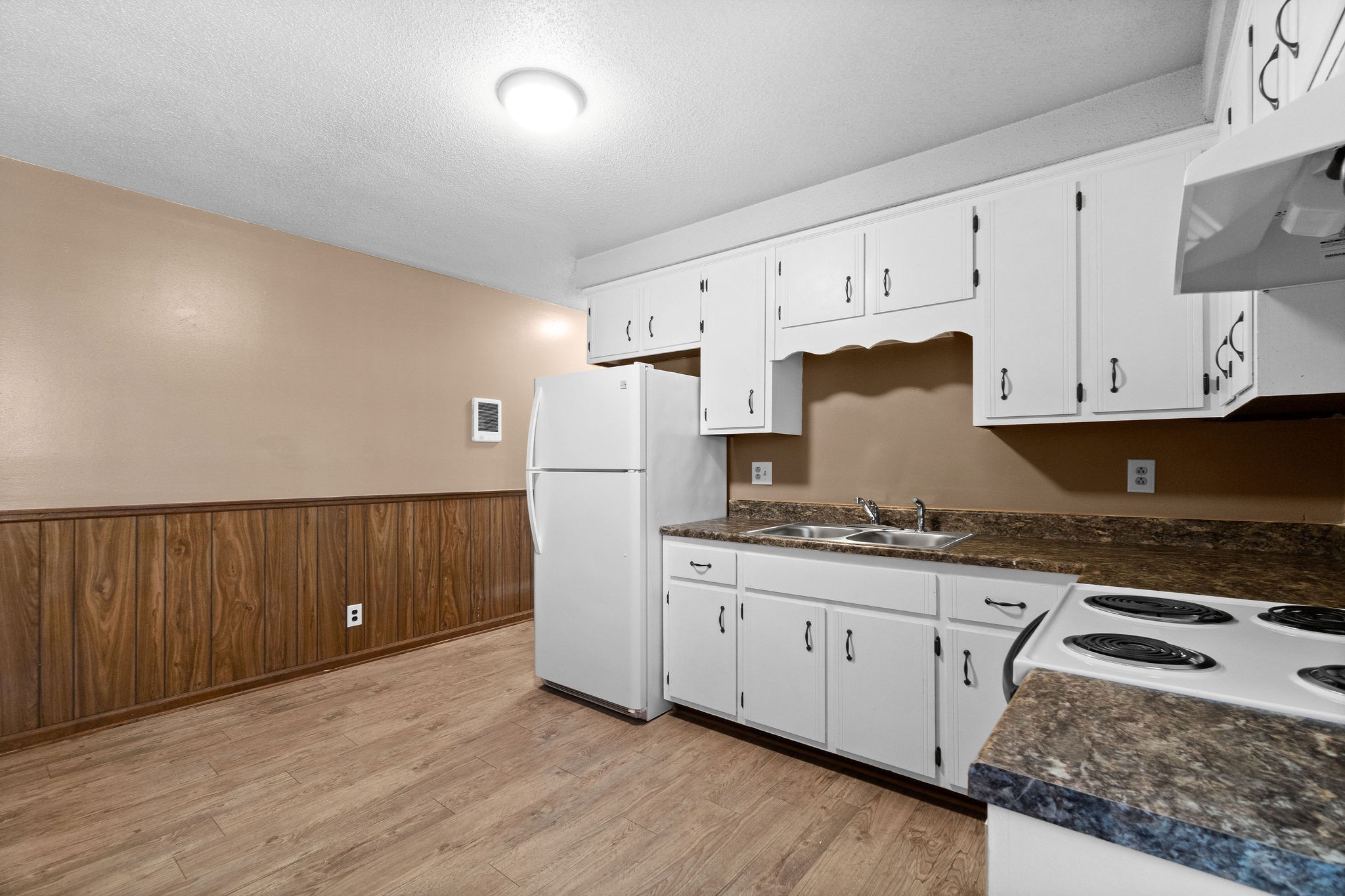 1908 Batts Lane, Unit C Clarksville, TN 37042 - Photo 11 of 14 a kitchen with granite countertop a stove a sink and a refrigerator