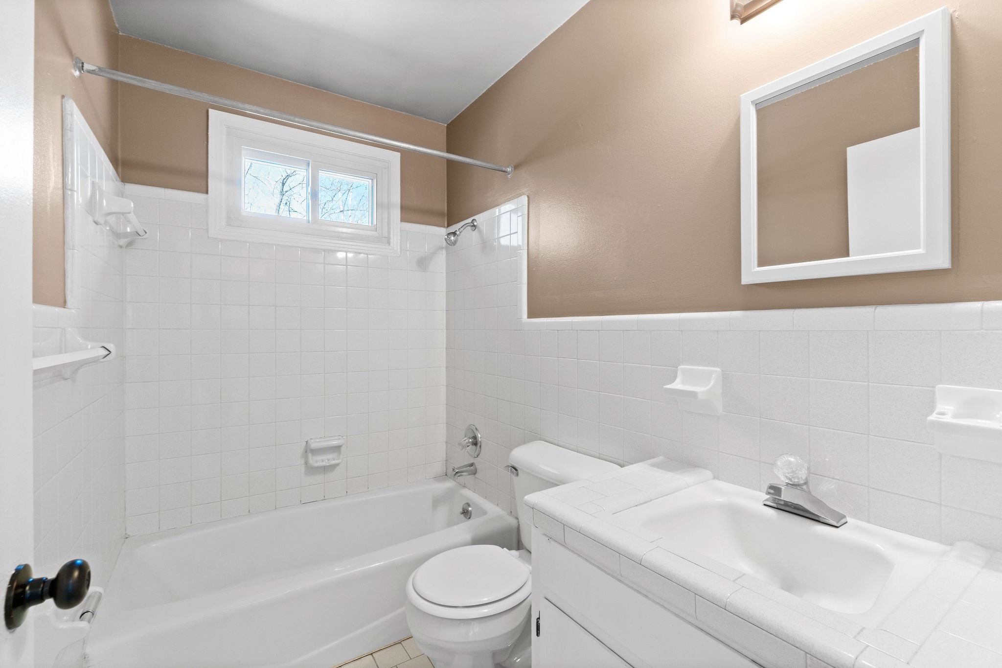 1908 Batts Lane, Unit C Clarksville, TN 37042 - Photo 13 of 14 a bathroom with a sink a toilet and a bathtub