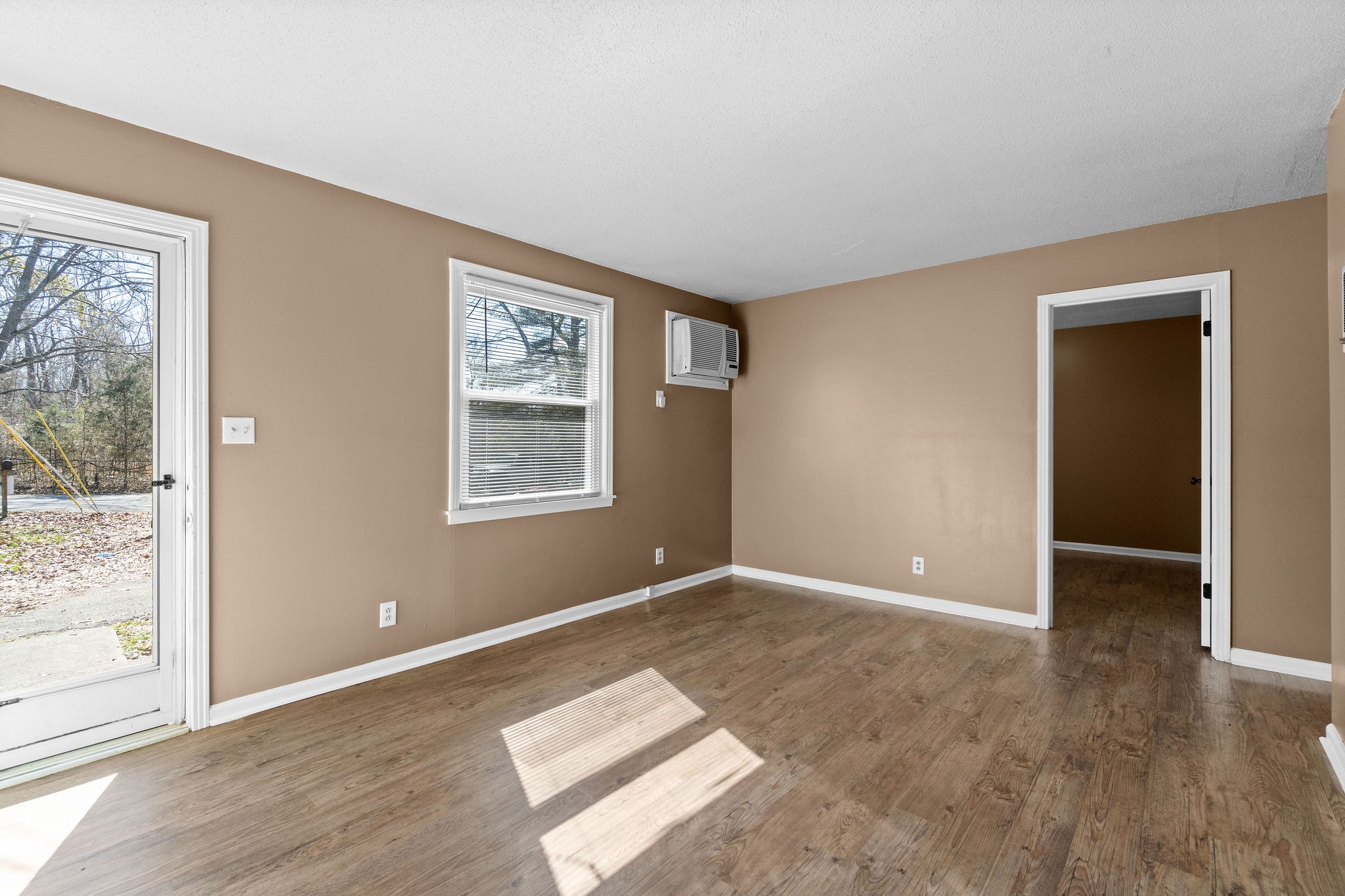 1908 Batts Lane, Unit C Clarksville, TN 37042 - Photo 4 of 14 a view of an empty room with wooden floor and a window
