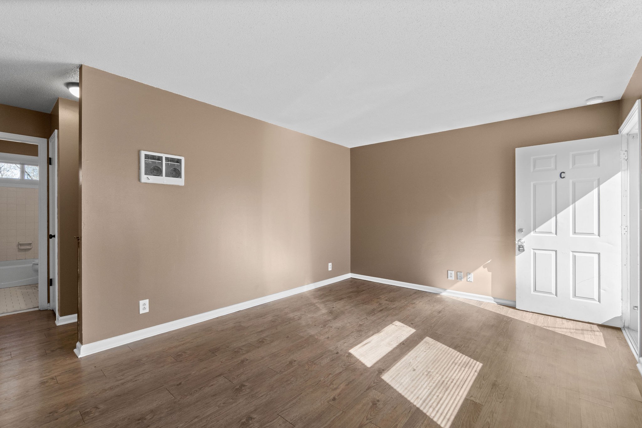 1908 Batts Lane, Unit C Clarksville, TN 37042 - Photo 5 of 14 a view of an empty room with a window