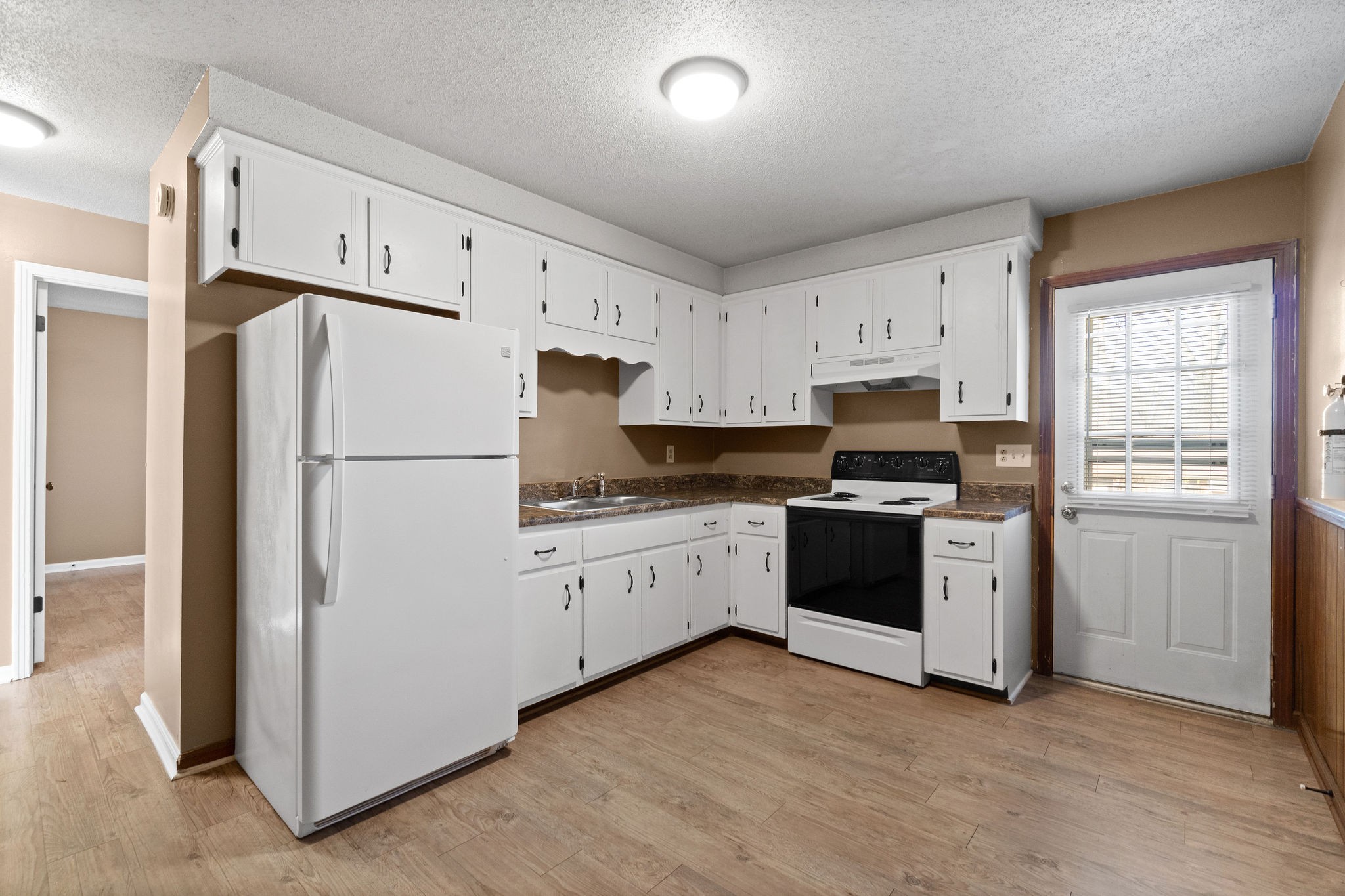 1908 Batts Lane, Unit C Clarksville, TN 37042 - Photo 8 of 14 a kitchen with cabinets stainless steel appliances and a refrigerator