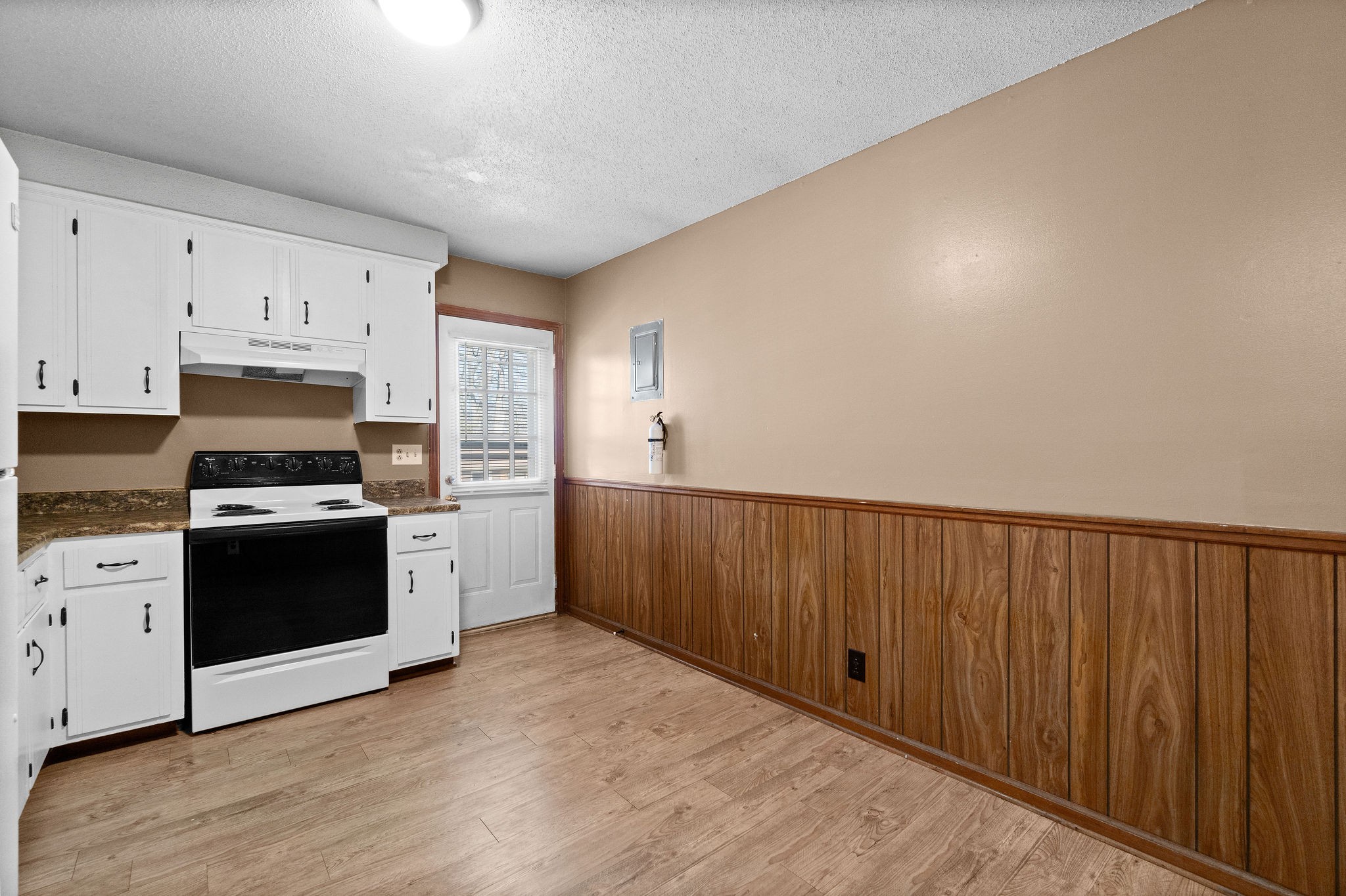 1908 Batts Lane, Unit C Clarksville, TN 37042 - Photo 9 of 14 a kitchen with wooden cabinets and stainless steel appliances