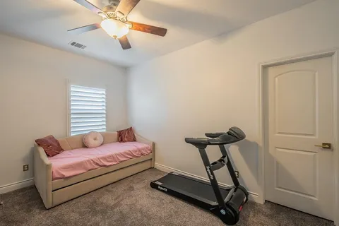 a bedroom with furniture and a window