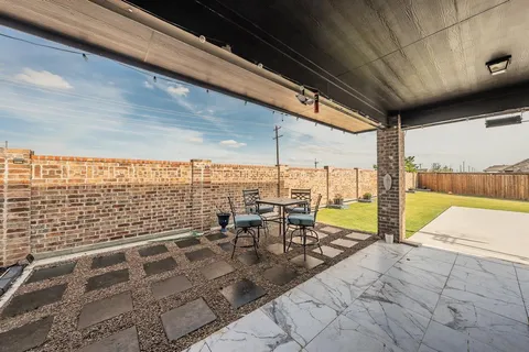 a view of swimming pool with outdoor seating