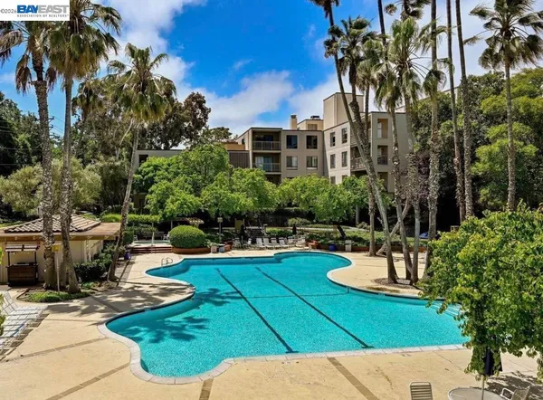 a view of a livingroom with a furniture wooden floor and a window