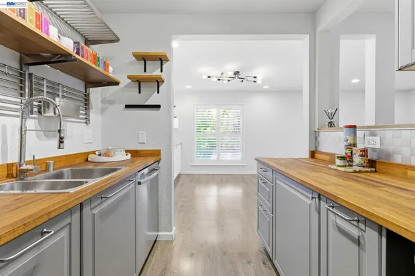 a bathroom with a toilet a sink and a large mirror