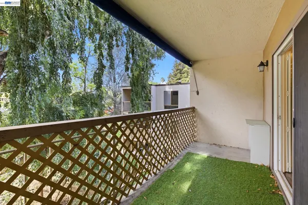 a room with pool table and windows
