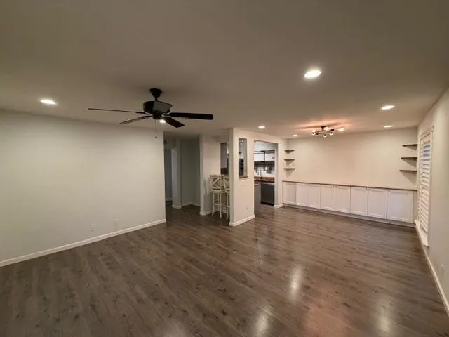 a view of a kitchen with a sink and a refrigerator