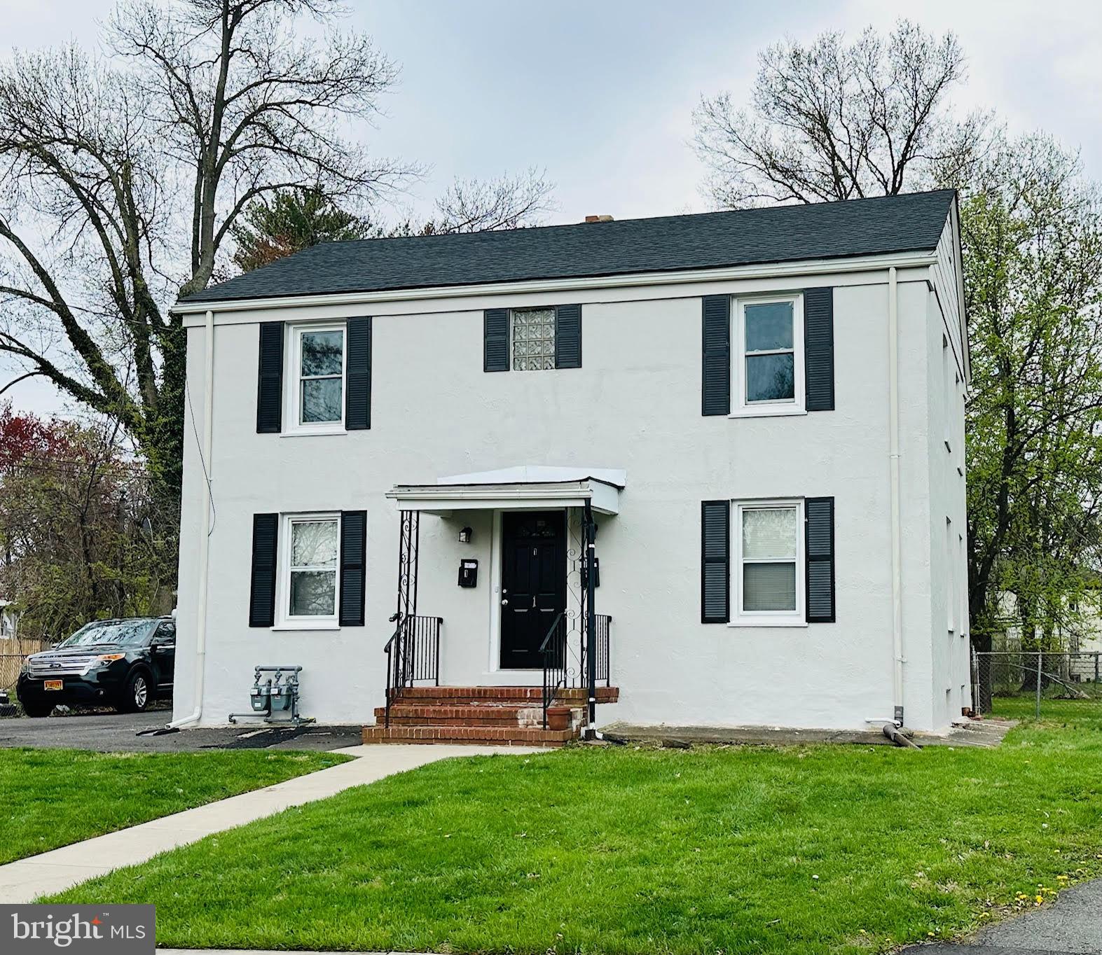 a house that has a big yard in front of it