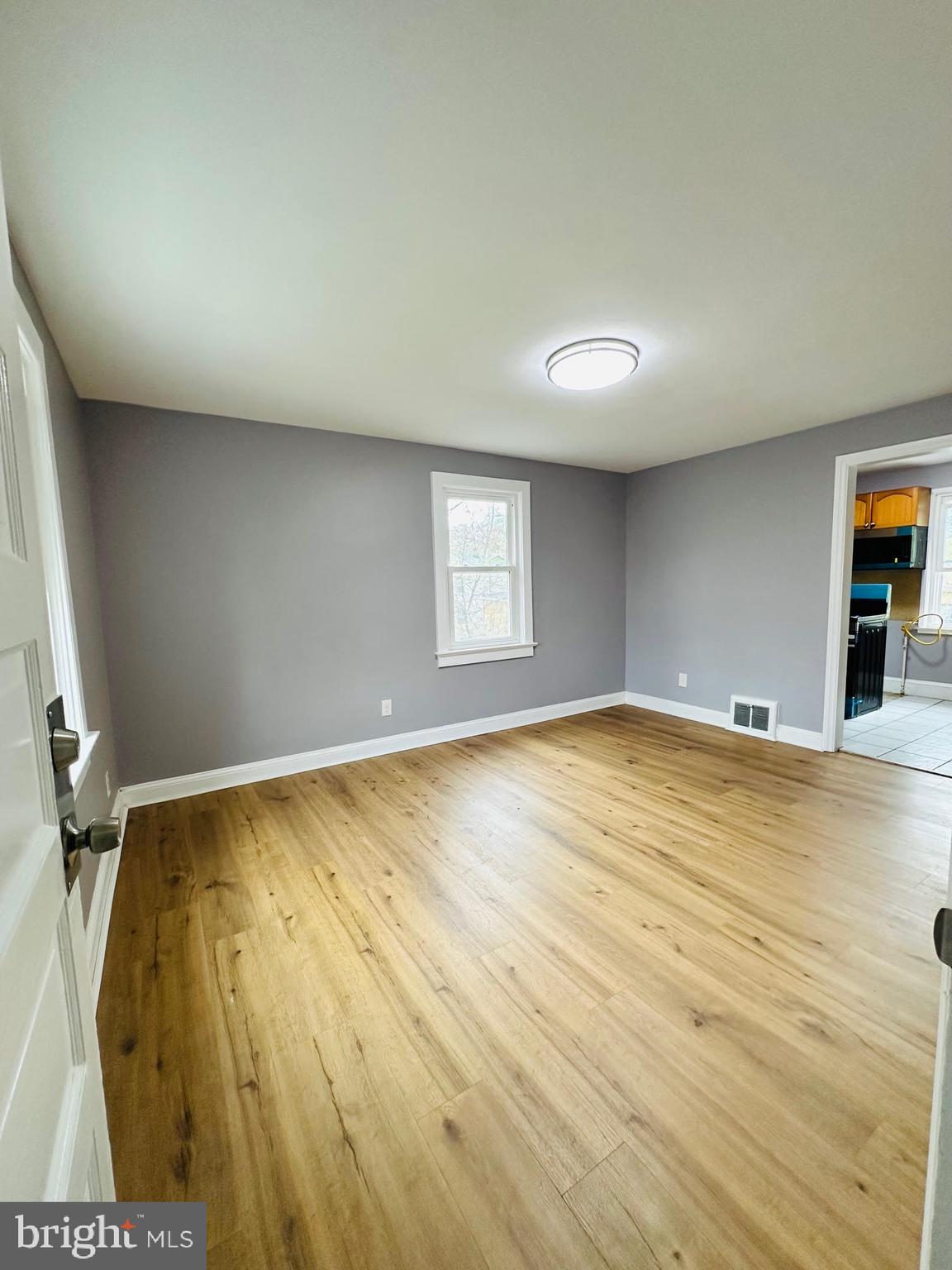 1 Marion Court, Unit 2 Ewing, NJ 08618 - Photo 3 of 9 a view of empty room with wooden floor