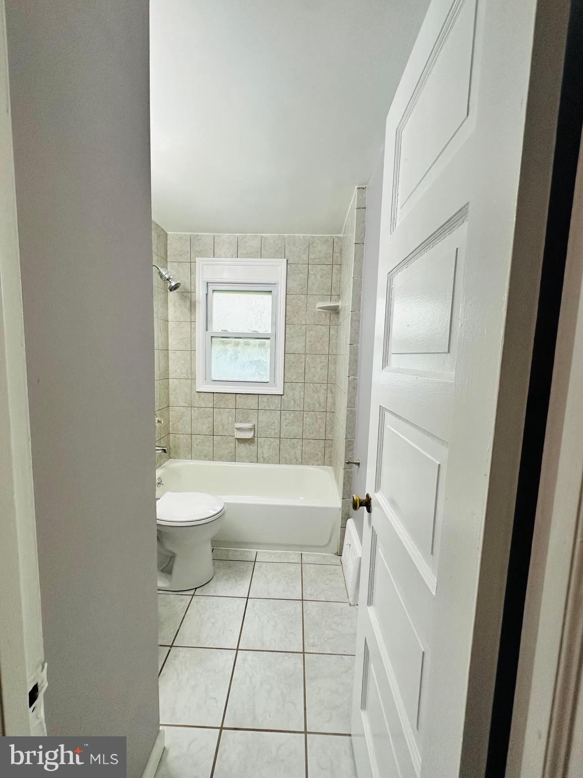 1 Marion Court, Unit 2 Ewing, NJ 08618 - Photo 8 of 9 a bathroom with a sink a toilet and shower