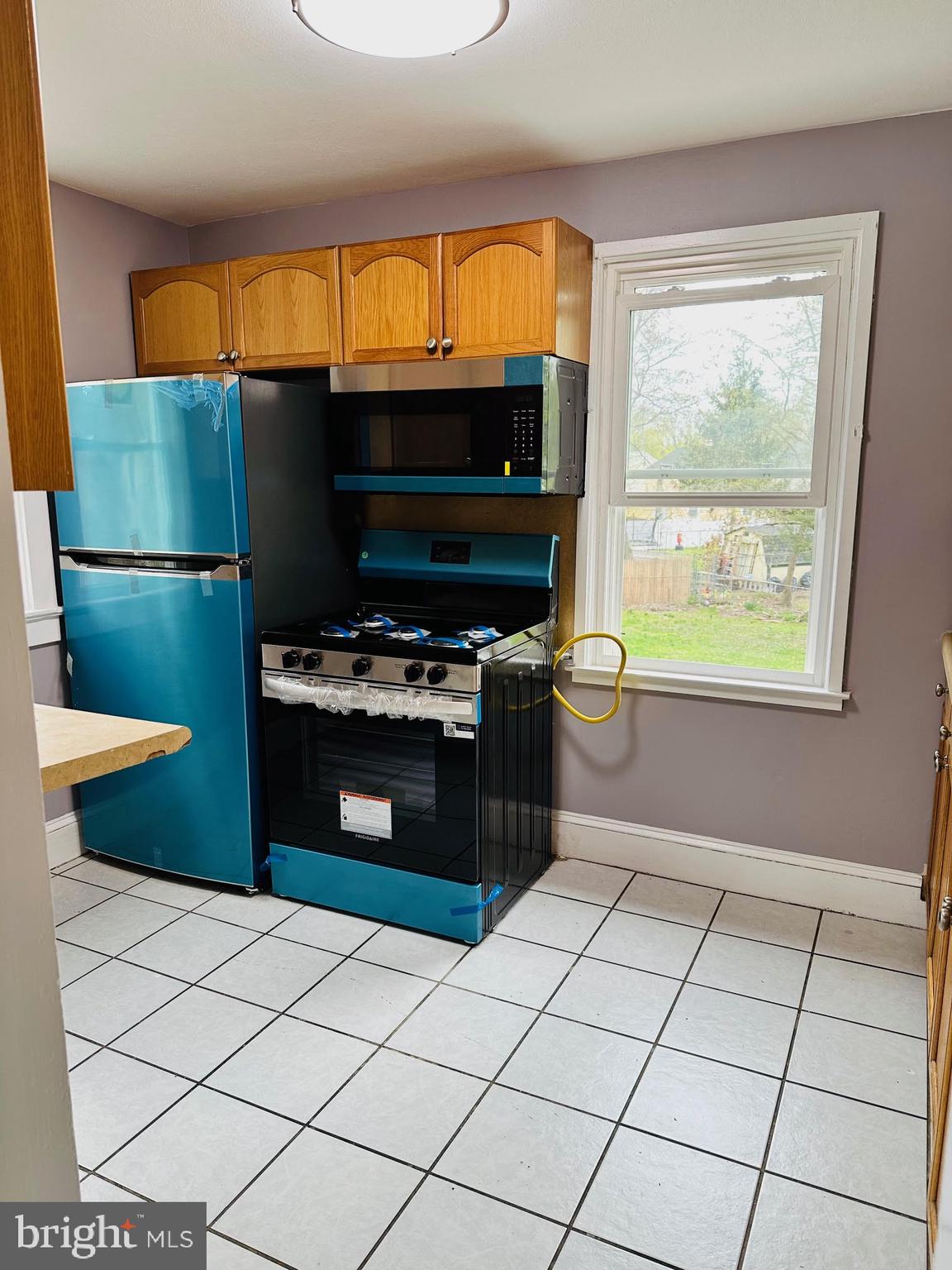 1 Marion Court, Unit 2 Ewing, NJ 08618 - Photo 9 of 9 a kitchen with stainless steel appliances a stove a sink and a microwave