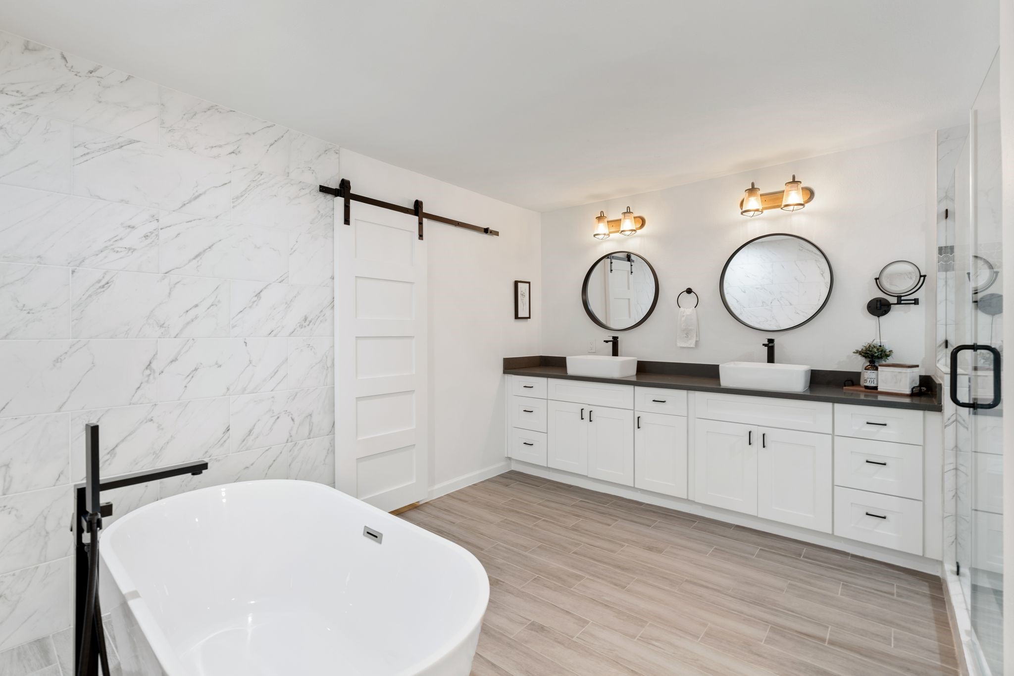 10619 Cranbrook Road Houston, TX 77042 - Photo 20 of 32 a bathroom with a double vanity sink and a mirror