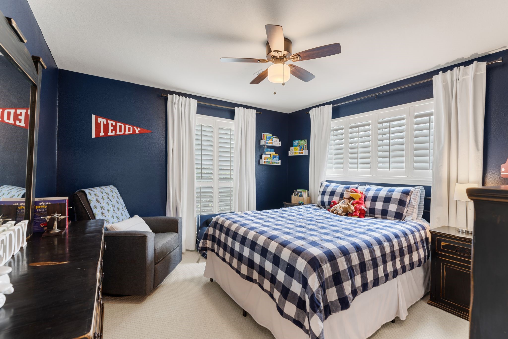10619 Cranbrook Road Houston, TX 77042 - Photo 22 of 32 a bedroom with a bed and a chandelier