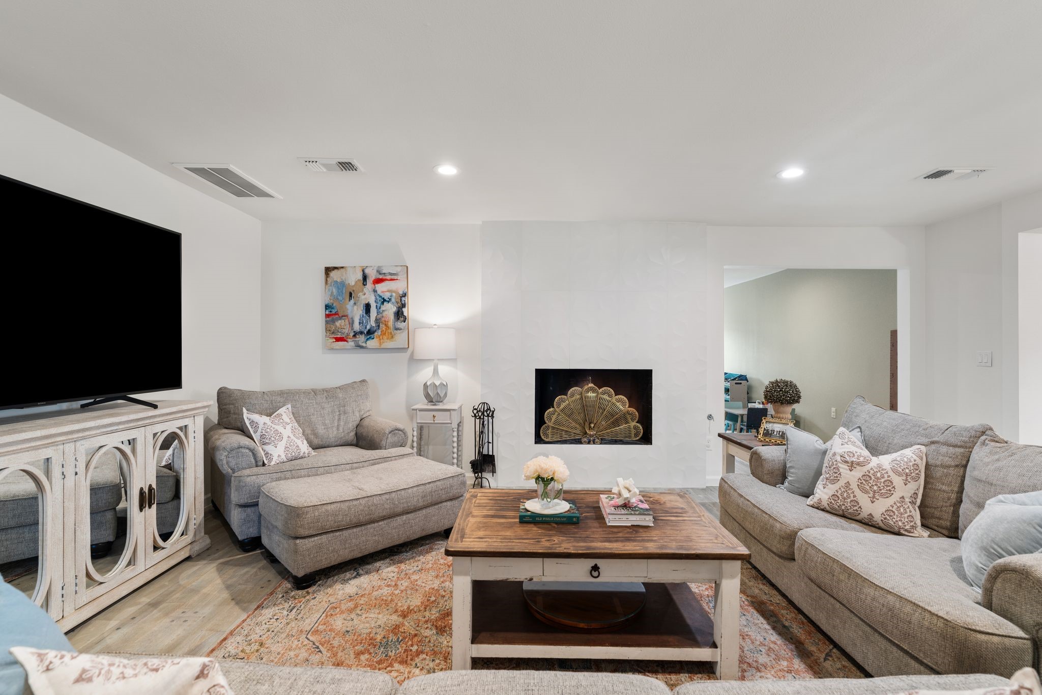 10619 Cranbrook Road Houston, TX 77042 - Photo 9 of 32 a living room with furniture and a flat screen tv