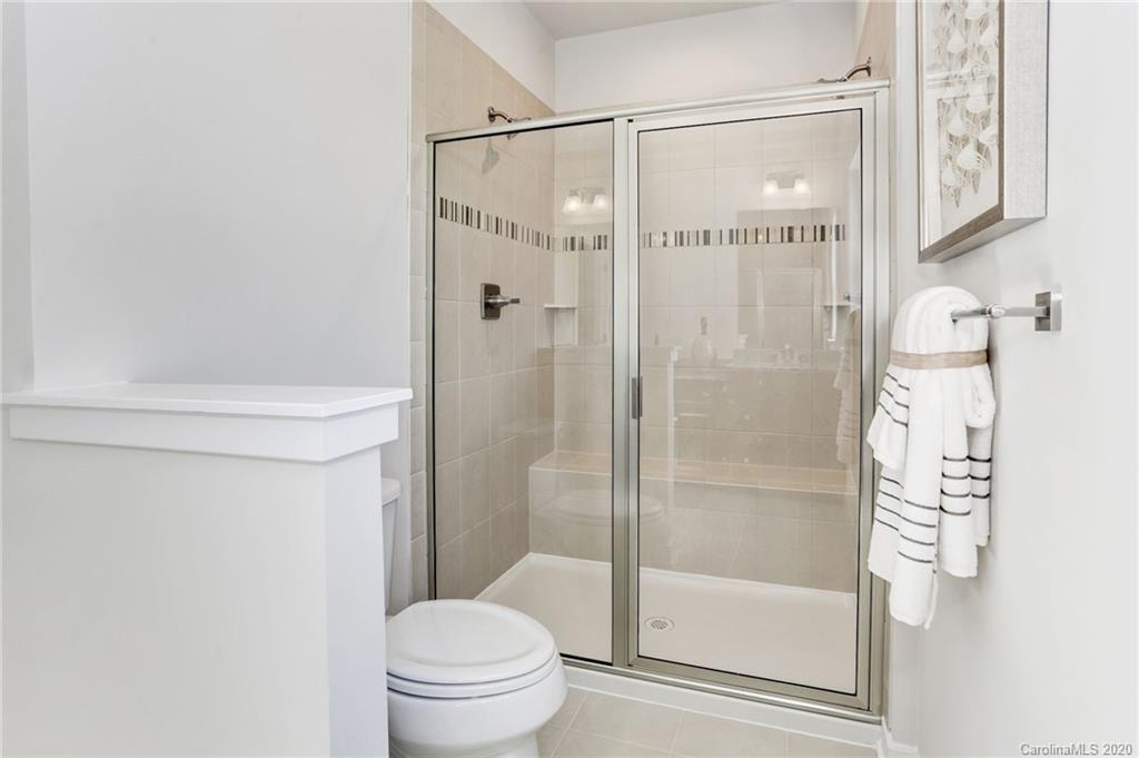 638 Crudent Road, Unit 1006D Tega Cay, SC 29708 - Photo 8 of 12 a bathroom with a shower and a toilet