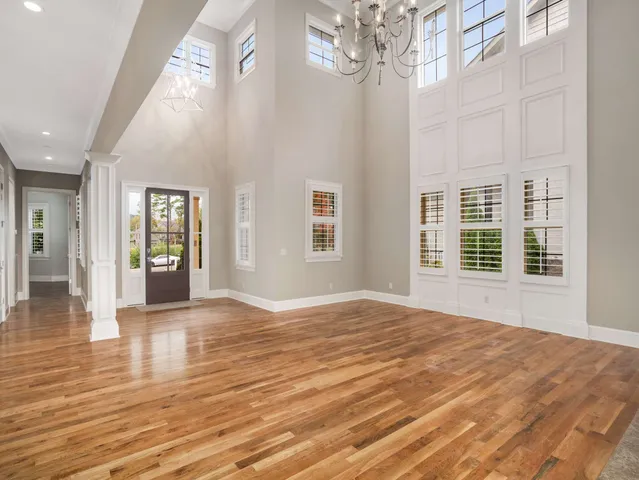 a view of empty room with fireplace and flat screen tv