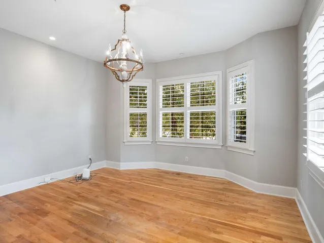 a picture of a room with a table and a chandelier