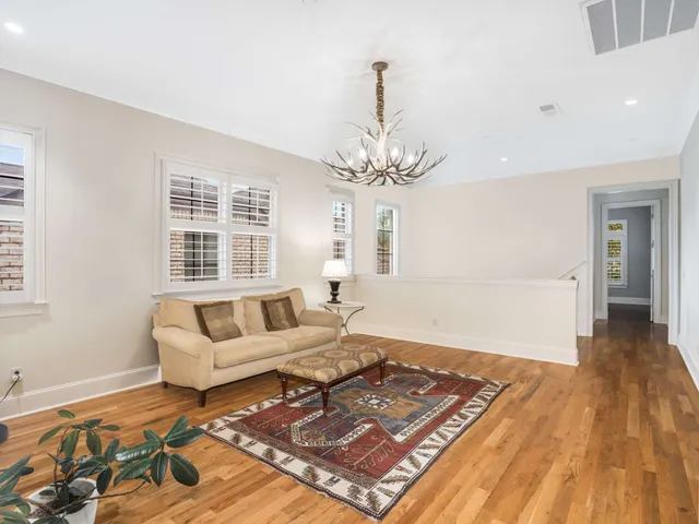 a view of empty room with window and ceiling fan